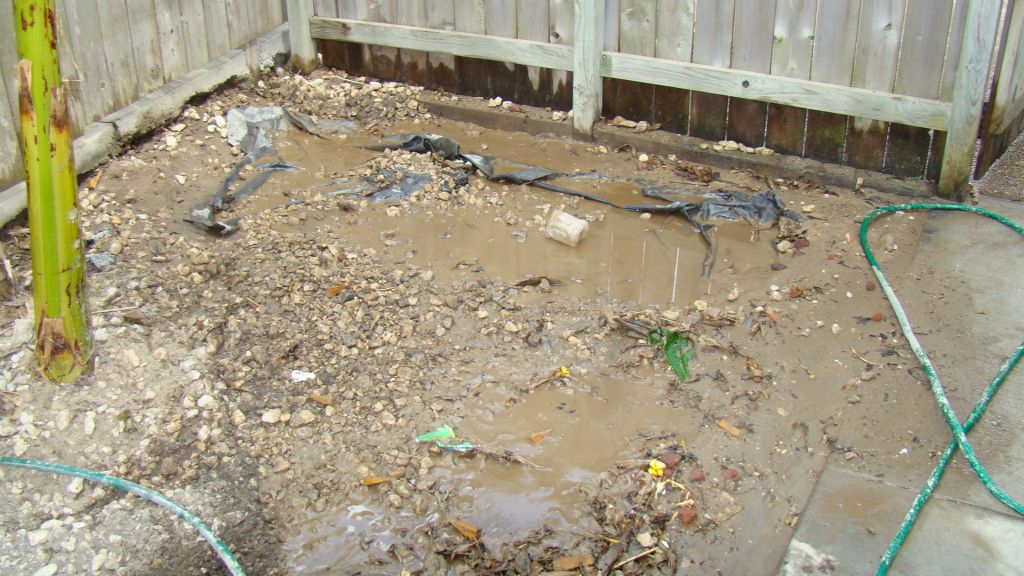 UNUSEABLE AREA AT SIDE OF HOUSE